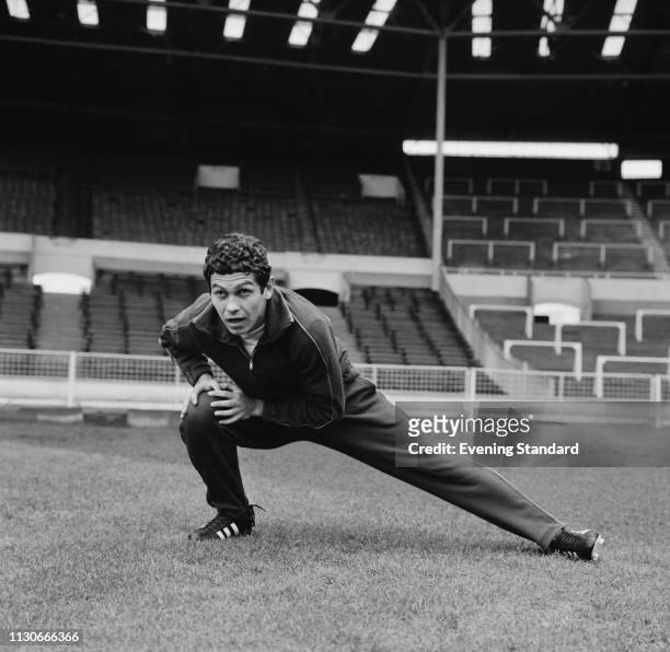 Romanian soccer player Mircea Lucescu doing a side lunge at Wembley Stadium in preparation of a match against England, London, UK, 15th January 1969.