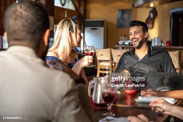 friends celebrate a birthday enjoying sangria - middle east friends stock pictures, royalty-free photos & images
