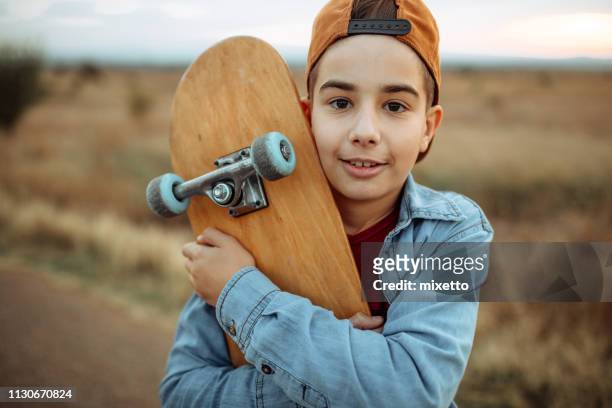 his favorite toy - teenage boy in cap posing stock pictures, royalty-free photos & images