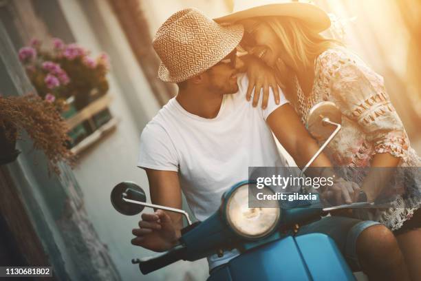 romantic scooter ride. - italy city break stock pictures, royalty-free photos & images