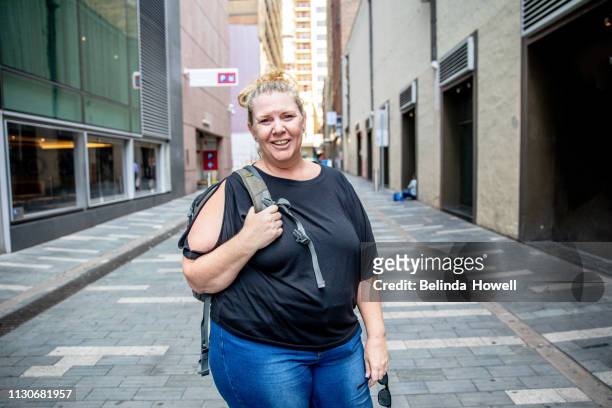 mature woman travelling solo, exploring the city and enjoying time alone in sydney australia - sydney side street stock pictures, royalty-free photos & images