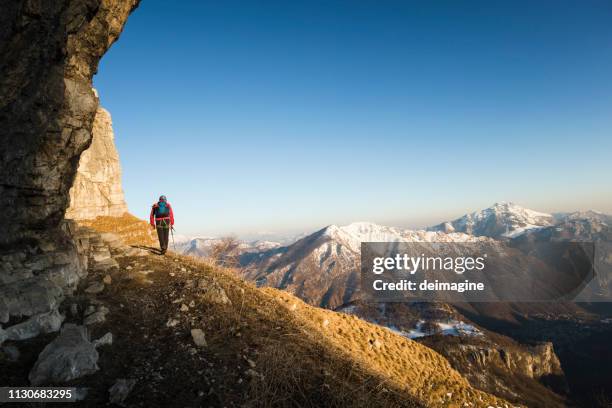 mountaineer walking on mountain ridge - patagonia chile stock pictures, royalty-free photos & images