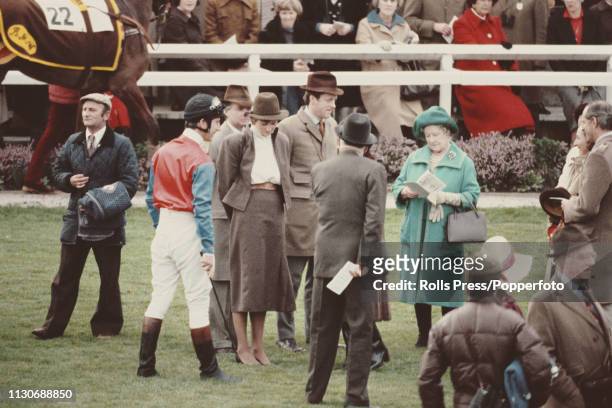 View of Prince Charles, wearing racing colours, pictured together with his fiancee Lady Diana Spencer and Queen Elizabeth The Queen Mother in the...