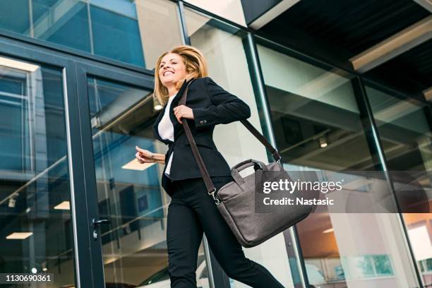 young fashionable business woman getting late - laptop bag stock pictures, royalty-free photos & images