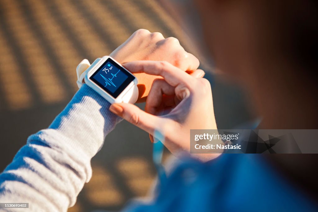 Checking Her Heart Rate on a smart watch