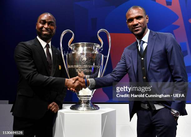 Manchester United Club Ambassador Andrew Cole and Barcelona Director of Football Eric Abidal with the trophy following the UEFA Champions League...