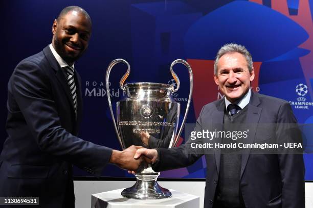 Tottenham Club Representative Ledley King and Manchester City Director of Football Txiki Begiristain with the trophy following the UEFA Champions...