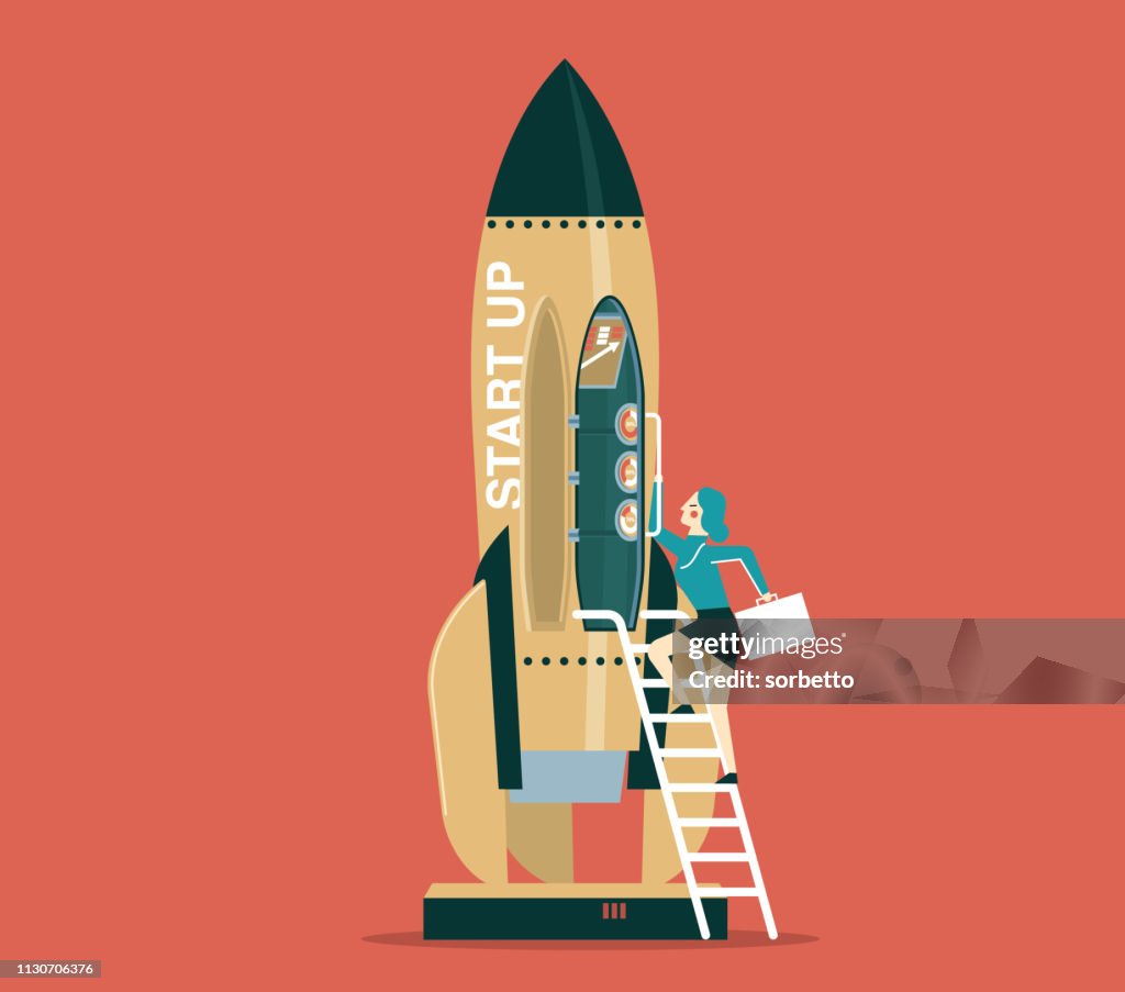 Business startup with space rocket - Businesswoman