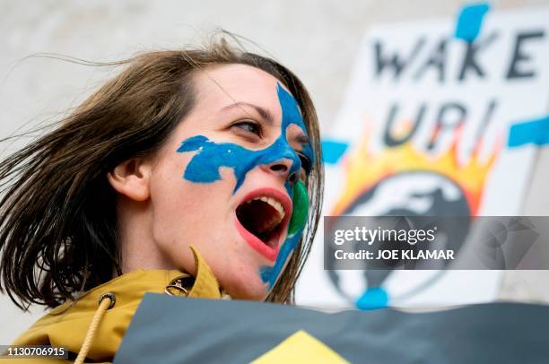 An Austrian youth shouts slogans during a climate protest outside the Hofburg palace in Vienna as part of the "Fridays For Future" movement on a...