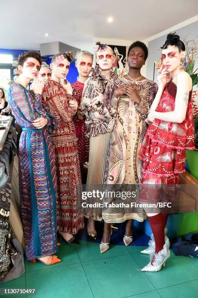 Models pose backstage ahead of the Zandra Rhodes Presentation during London Fashion Week February 2019 on February 19, 2019 in London, England.