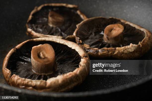 three portobello mushrooms cooking - portobello mushroom stock pictures, royalty-free photos & images