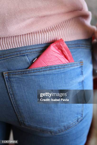 woman with sanitary pad at back pocket - jeans pocket stock pictures, royalty-free photos & images