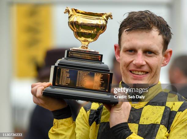 Cheltenham , United Kingdom - 15 March 2019; Jockey Paul Townend celebrates with the trophy after winning the Magners Cheltenham Gold Cup Chase on Al...