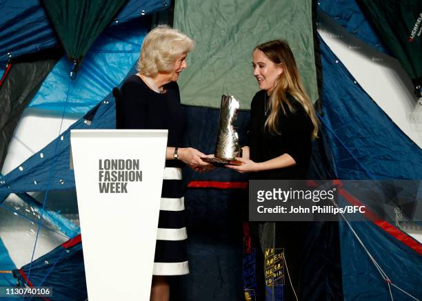 Camilla, Duchess Of Cornwall awards the Queen Elizabeth II award for British Design to designer Bethany Williams at the Bethany Williams show during...
