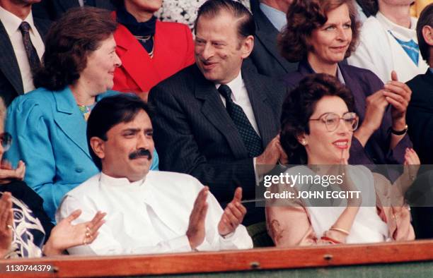 Prime Minister Benazir Bhutto of Pakistan and her husband Asif Ali Zardari attend tennis chamionship, 09 July 1989, in Wimbledon.