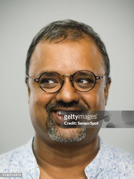 real indian man with excited expression looking to the side - chubby arab stock pictures, royalty-free photos & images