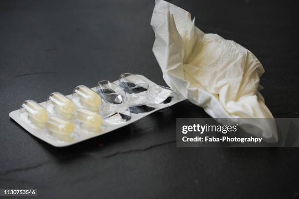 pills and tissues - erkältung stock pictures, royalty-free photos & images