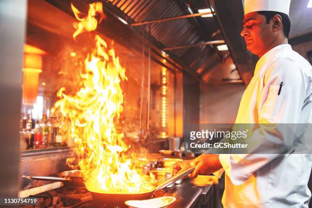 chef preparing meals for special guests at a restaurant - personal chef stock pictures, royalty-free photos & images
