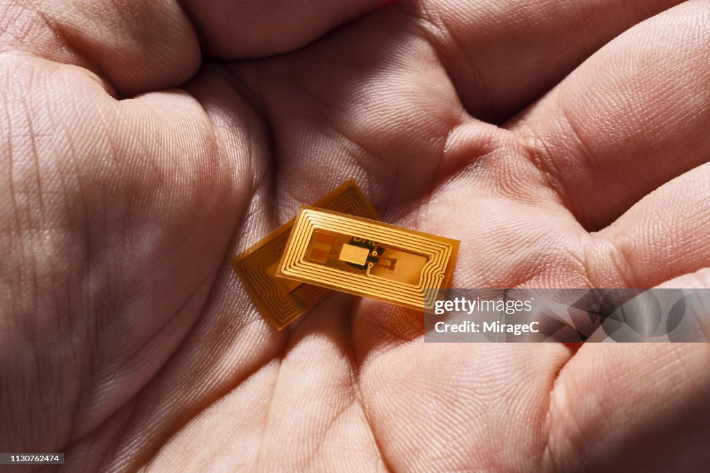 Tiny RFID NFC Labels in Hand Palm