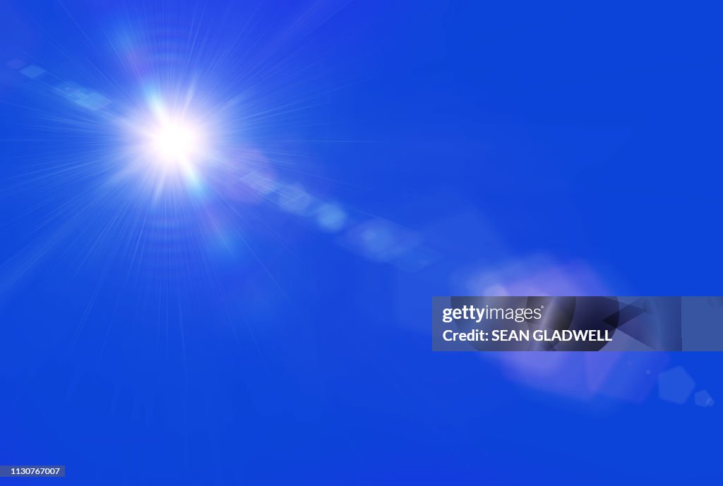 Sun lens flare blue sky