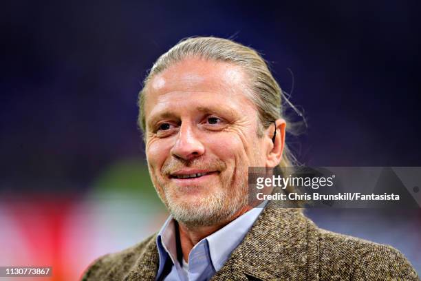 Emmanuel Petit looks on before the UEFA Champions League Round of 16 First Leg match between Olympique Lyonnais and FC Barcelona at Groupama Stadium...