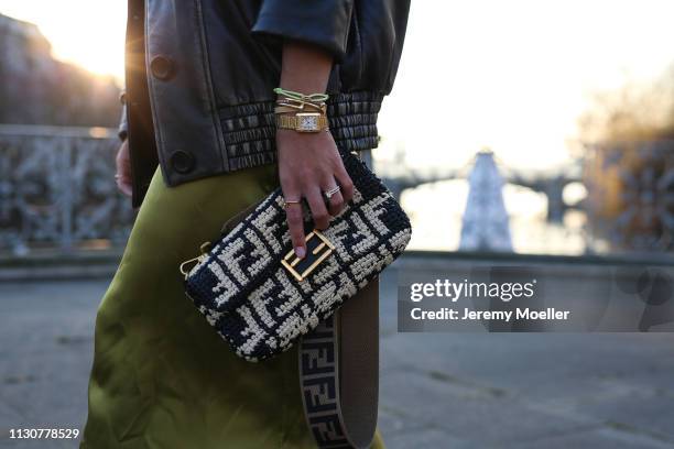 Aylin Koenig wearing Fendi bag, Chanel belt, Miu Miu leather jacket, Cos dress on February 18, 2019 in Hamburg, Germany.