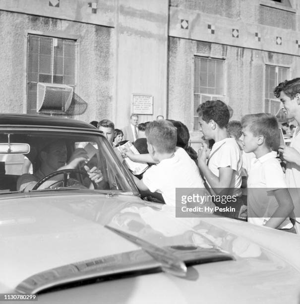 New York Yankees Whitey Ford in car mobbed by fans wanting autographs after game vs Cleveland Indians at Yankee Stadium. Bronx, NY 9/2/1954 CREDIT:...