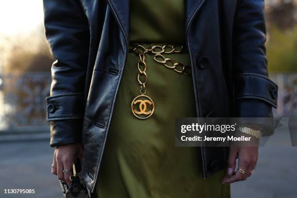 Aylin Koenig wearing Chanel belt, Miu Miu leather jacket, Cos dress on February 18, 2019 in Hamburg, Germany.