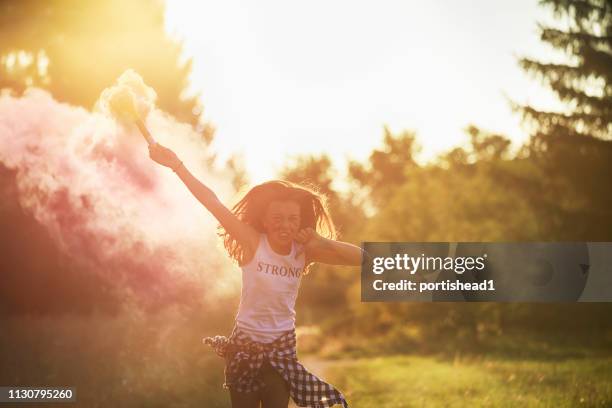 girl in pink smoke - leading edge stock pictures, royalty-free photos & images