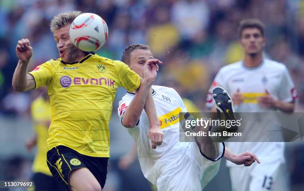 Jakub Blaszczykowski of Dortmund gets a shoot of Filip Daems of Moenchengladbach in his face during the Bundesliga match between Borussia...