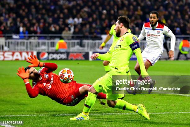 Anthony Lopes of Olympique Lyonnais saves a shot from Lionel Messi of FC Barcelona during the UEFA Champions League Round of 16 First Leg match...