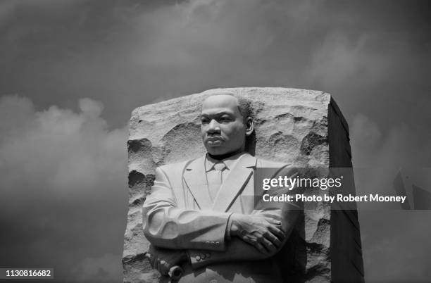 close-up of martin luther king, jr. memorial against a background of dramatic clouds (washington dc) - martin luther king jr photos stock pictures, royalty-free photos & images