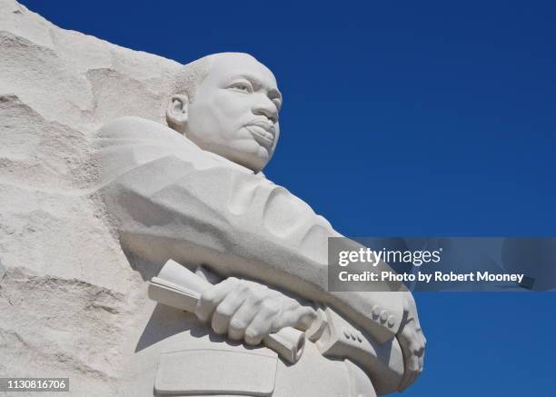 close-up of the martin luther king, jr. memorial against a blue sky (washington dc) - martin luther king memorial stock-fotos und bilder