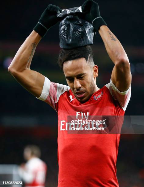 Pierre-Emerick Aubameyang of Arsenal celebrate with a mask during Europa League Round of 16 2nd Leg between Arsenal and Rennes at Emirates stadium ,...