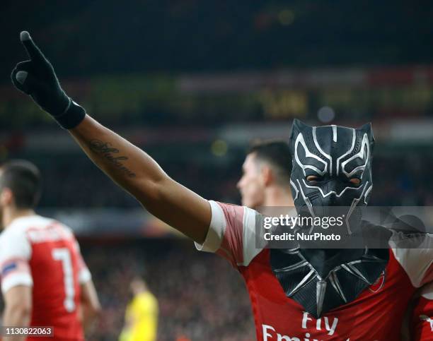 Pierre-Emerick Aubameyang of Arsenal celebrate with a mask during Europa League Round of 16 2nd Leg between Arsenal and Rennes at Emirates stadium ,...