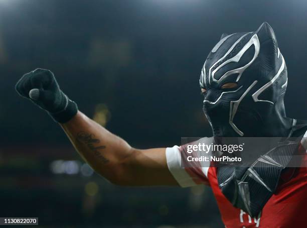 Pierre-Emerick Aubameyang of Arsenal celebrate with a mask during Europa League Round of 16 2nd Leg between Arsenal and Rennes at Emirates stadium ,...