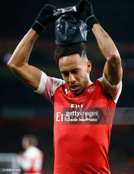 Pierre-Emerick Aubameyang of Arsenal celebrate with a mask during Europa League Round of 16 2nd Leg between Arsenal and Rennes at Emirates stadium ,...