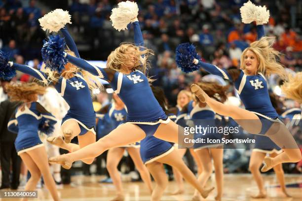 Kentucky Wildcats cheerleaders perform during a Southeastern Conference Tournament game between the Kentucky Wildcats and Alabama Crimson Tide, March...
