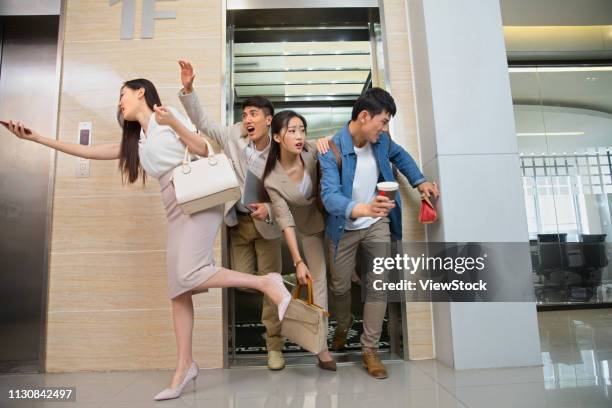 business men and women crowded elevators - crowded elevator stockfoto's en -beelden