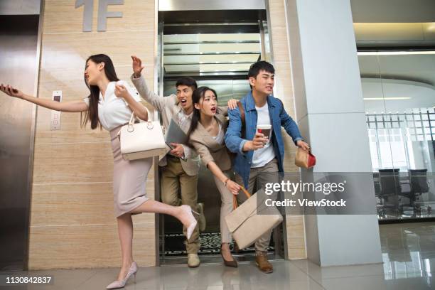 business men and women crowded elevators - crowded elevator stockfoto's en -beelden