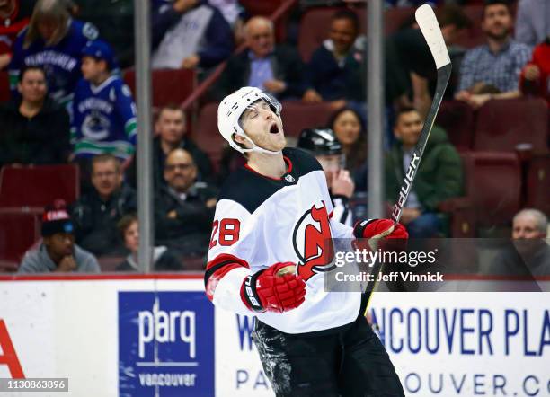 Damon Severson of the New Jersey Devils celebrates after scoring the game winning goal during the shootout of their NHL game against the Vancouver...