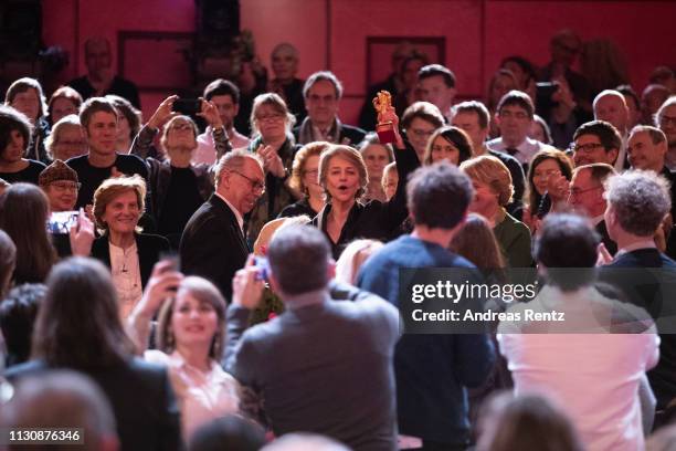 Festival director Dieter Kosslick and Charlotte Rampling are seen in the audience at the Homage Charlotte Rampling Honorary Golden Bear award...