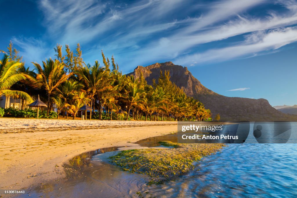 Sunrise on a tropical sandy beach, Le Morne Brabant, Mauritius island