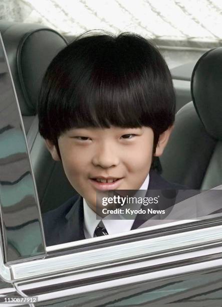 Prince Hisahito, Japanese Emperor Akihito's grandson, heads to the Imperial Palace in Tokyo on March 16 to report his graduation the previous day...