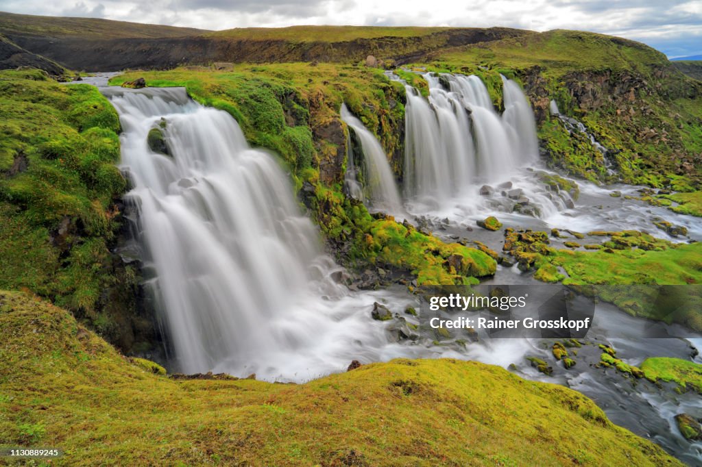 Several waterfalls in grassy land