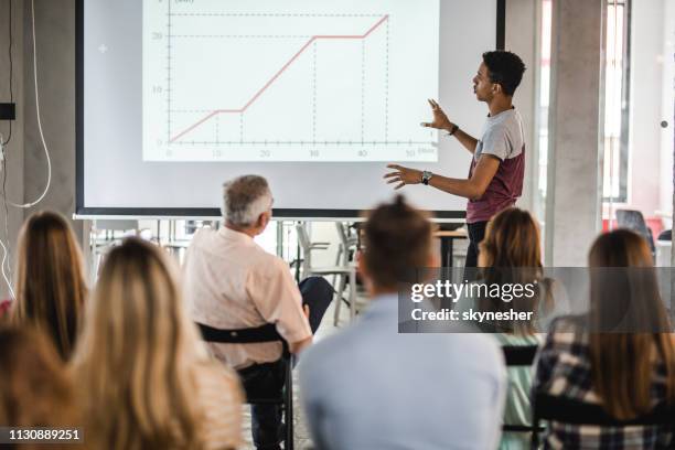 black university student giving a presentation during an education event. - classroom projector screen stock pictures, royalty-free photos & images