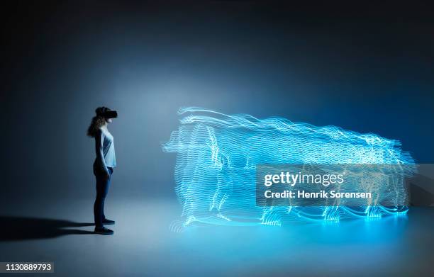 young woman with light trace - light trail people stock pictures, royalty-free photos & images