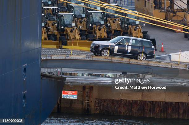 Land Rover, made by British multinational car manufacturer Jaguar Land Rover, is driven on to a container ship at the Port of Southampton on February...