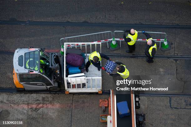 Passenger bags are loaded onto a cruise ship by baggage handlers at the Port of Southampton on February 10, 2019 in Southampton, England. The Port of...