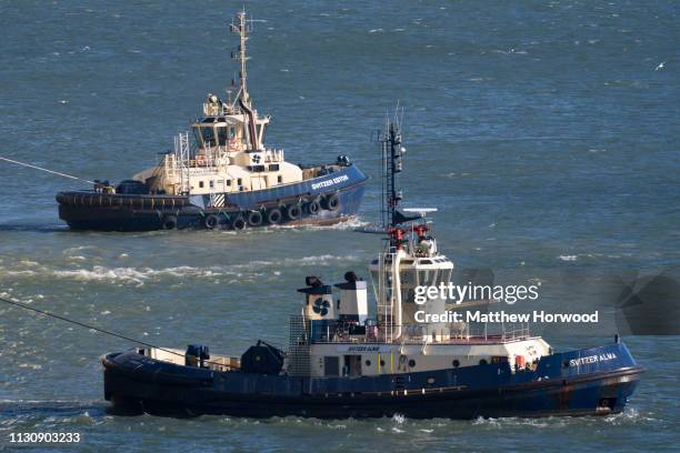 Tug boats in the water at the Port of Southampton on February 10, 2019 in Southampton, England. The Port of Southampton is a passenger and cargo port...